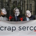 An image of people wearing facemasks of Dido Harding, Matt Hancock and Rupert Soames holding a banner which says 'Scrap Serco'.